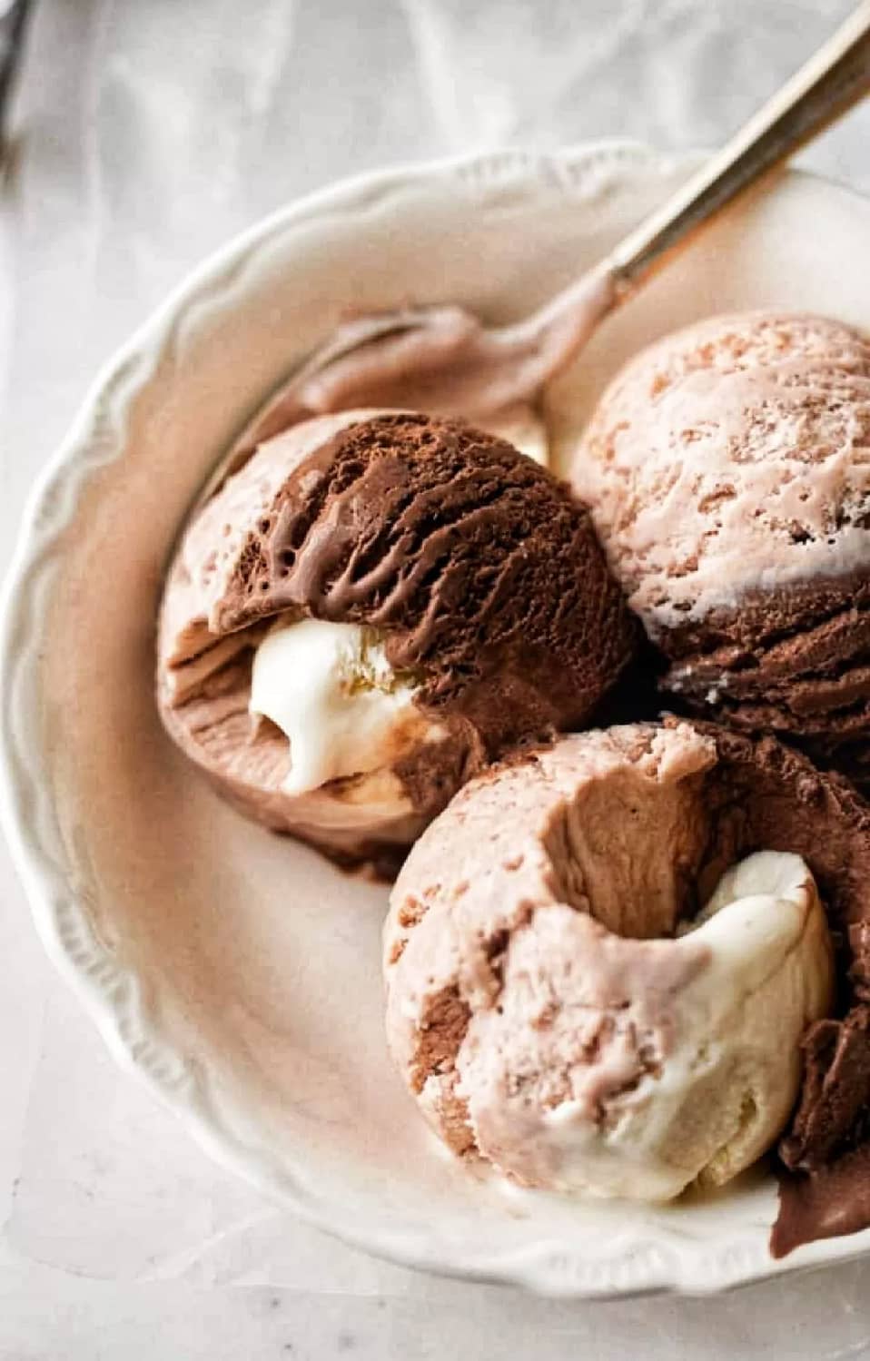 A hot afternoon Is complete with this easy homemade Neapolitan ice cream. This easy ice cream recipe is perfect for summer parties and It makes the perfect ending for a hot day after dinner